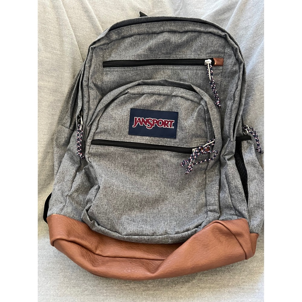 Jansport Gray Backpack with Brown Faux Leather Bottom